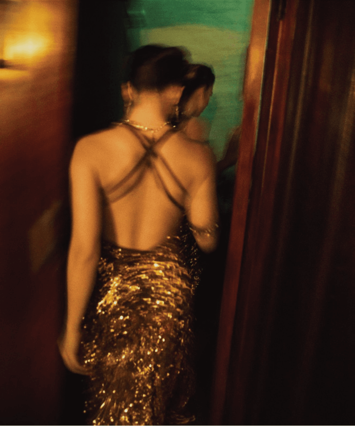 woman in elegant dress facing away from camera